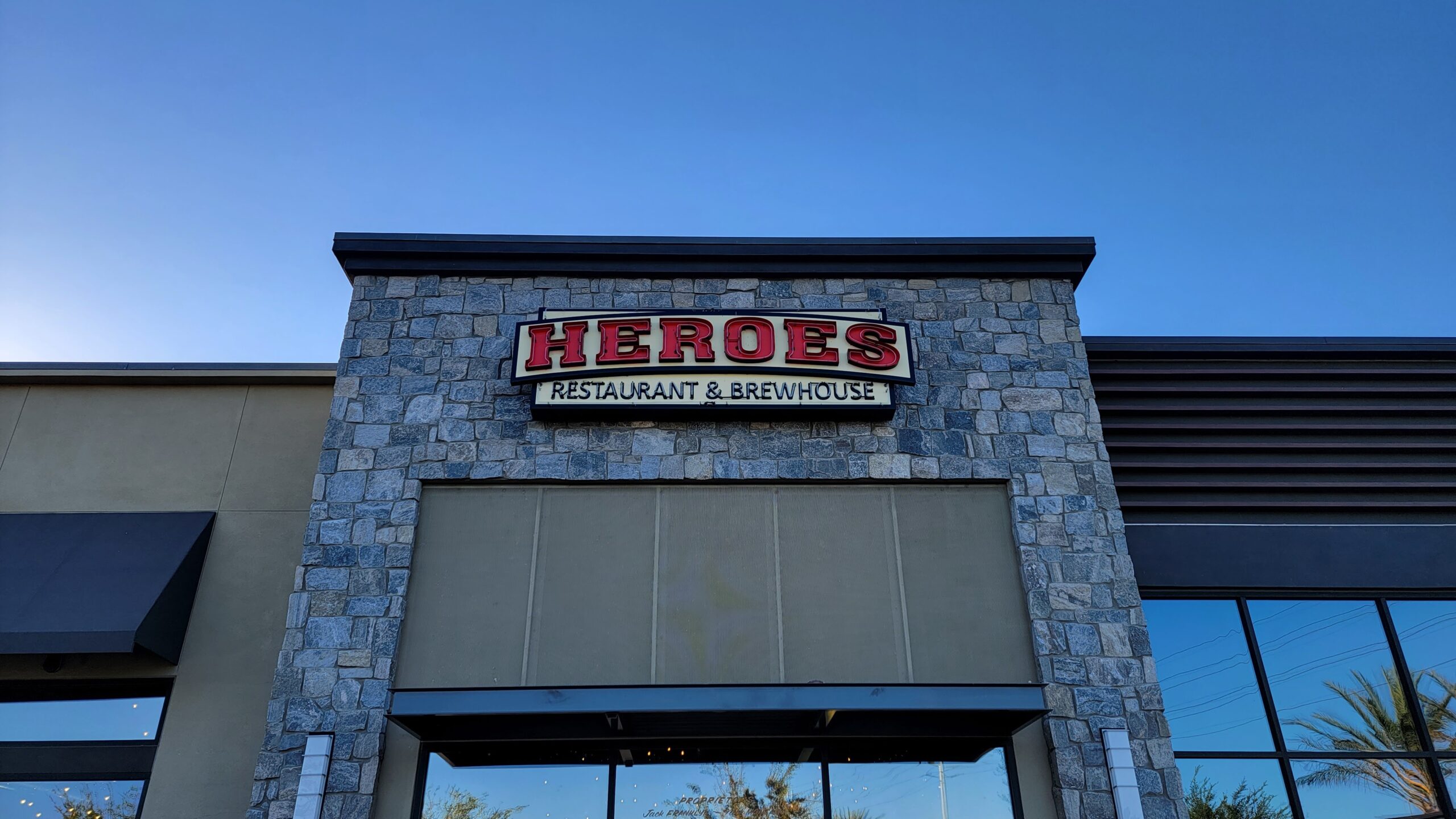 Heros exposed neon outdoor sign