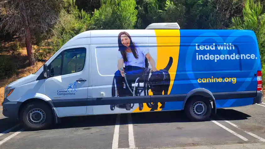 Innovative Sign Systems - Canine Companions Van Wrap (Oceanside, CA) Canine Companions van wrap by Innovative Sign Systems featuring service dog and wheelchair user, parked in Oceanside, CA