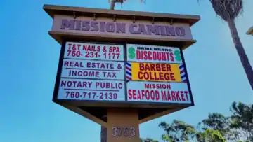 "Mission Camino" three-sided multi-tenant pylon sign in Oceanside, CA.
