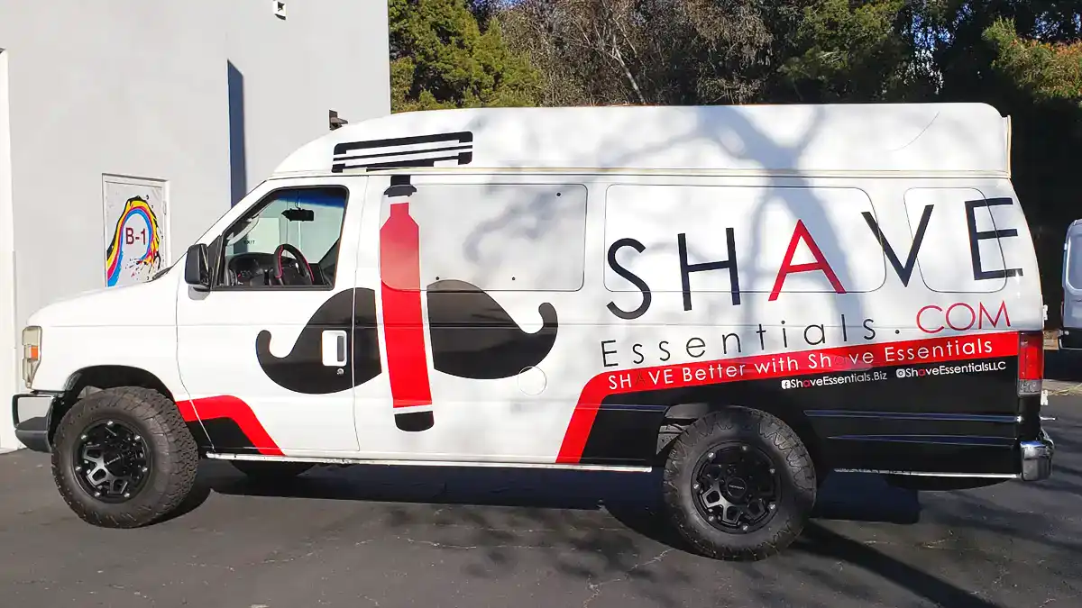 Custom branded van with shaving product graphics and signage for innovative signage solutions.