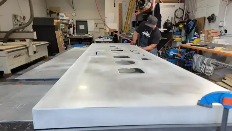 Heavy fabrication of custom illuminated signage at Innovative Sign Systems workshop.