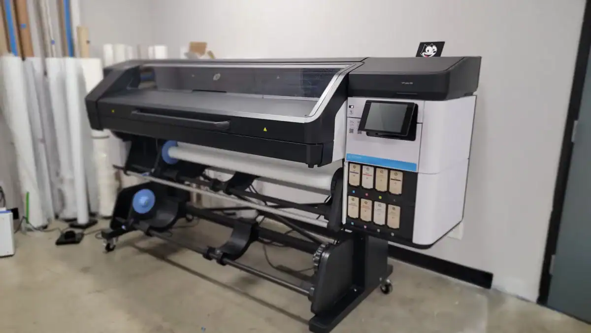 HP Latex 700 printer used for high-quality sign printing.