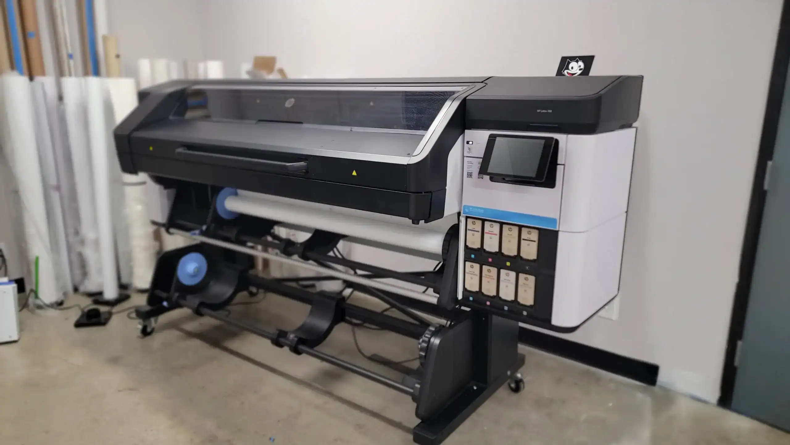 HP Latex 700 printer used for high-quality sign printing.